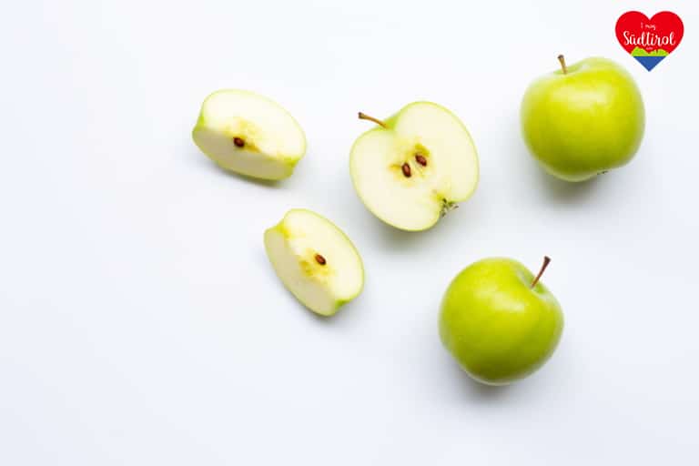 Green apples on white background. Copy space